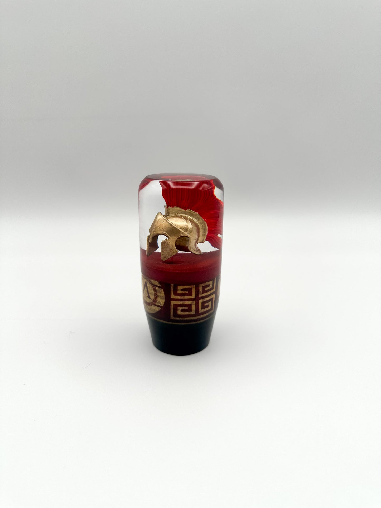Custom Spartan helmet shift knob in resin with Greek detailing. Slightly weighted for smooth shifts. Fits most manual and automatic cars. Built in the USA.