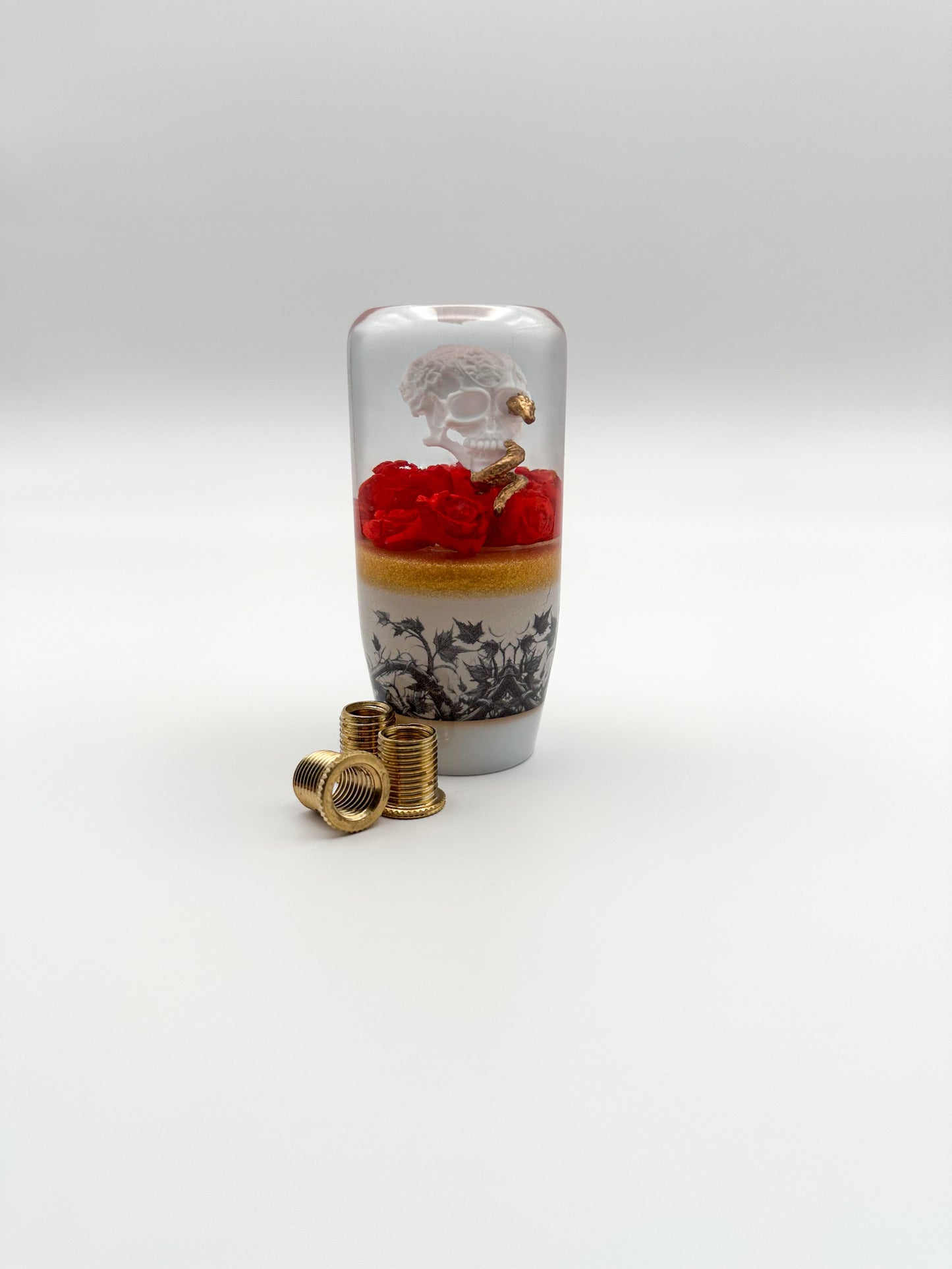 Upgrade your car with the Skull and Golden Snake resin shift knob. Bold gothic design, smooth weighted feel, and universal fit for most manual and automatic vehicles. Made in the USA for durability and style.
