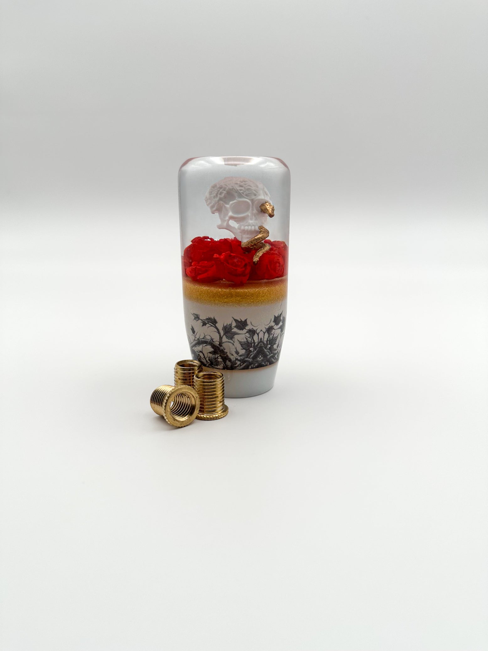 Upgrade your car with the Skull and Golden Snake resin shift knob. Bold gothic design, smooth weighted feel, and universal fit for most manual and automatic vehicles. Made in the USA for durability and style.