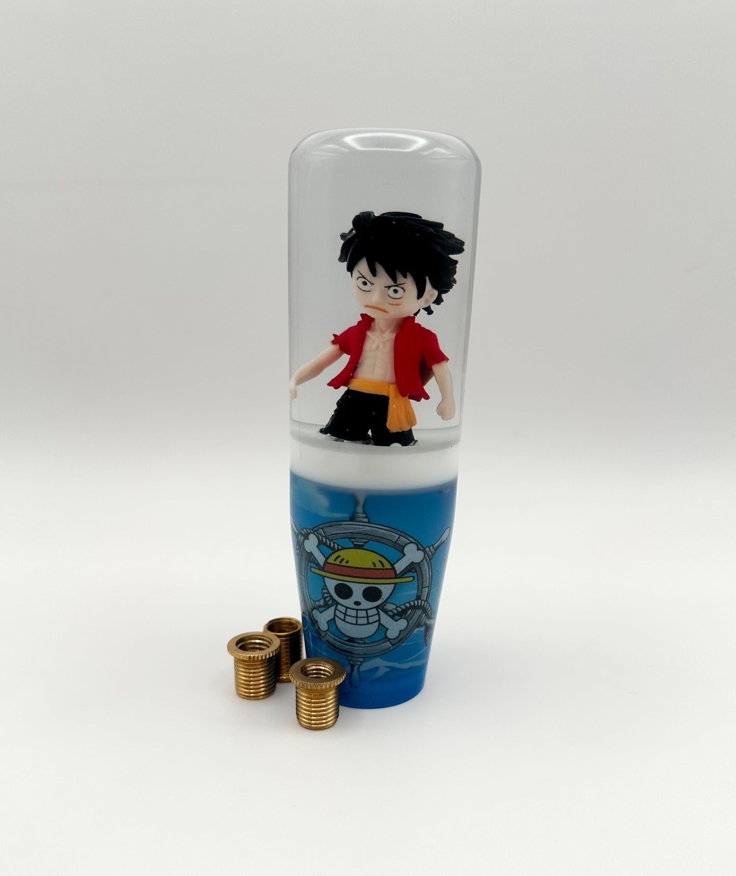 Anime-inspired One Piece shift knob with Luffy and pirate flag. Weighted for smooth shifting. Universal fit for most manual & automatic car setups.