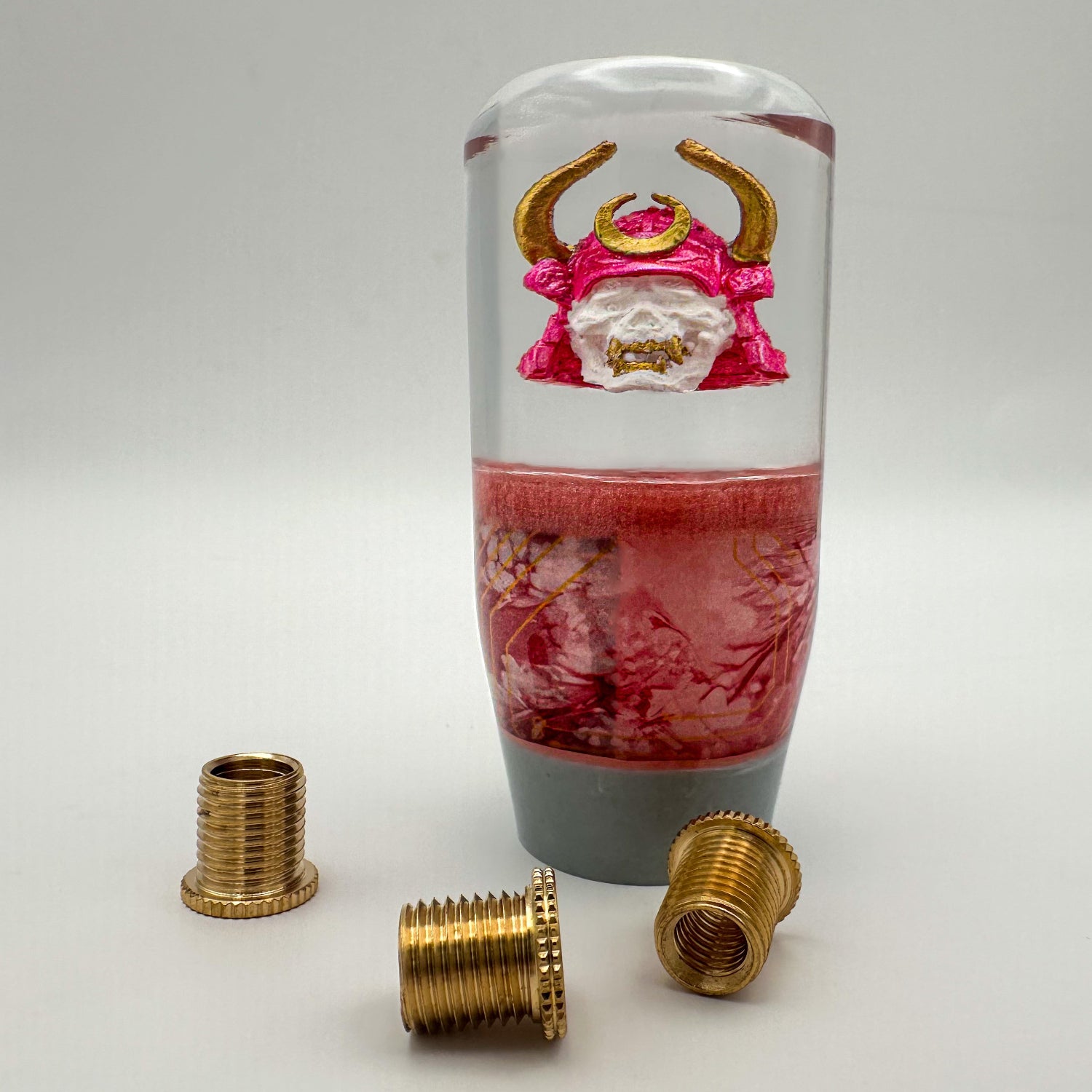 Cyberpunk Oni Samurai Shift Knob – custom resin gear shift with pink helmet, gold horns, and handcrafted Japanese demon detail.