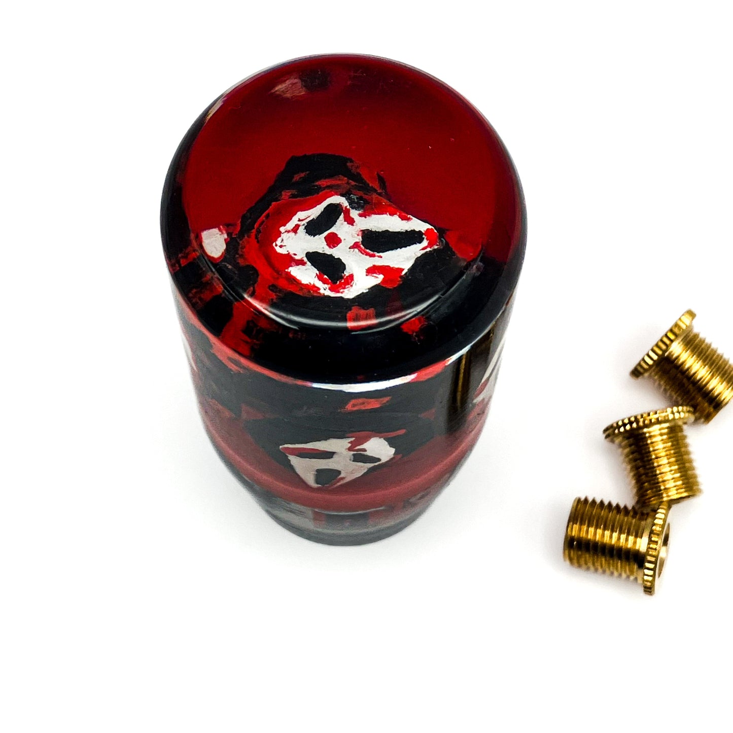 Ghostface resin shift knob by Nice Knob Bro featuring horror-inspired design in red and black, weighted for manual and automatic cars. Close-up of Ghostface shift knob in blood-red resin with glossy black base.