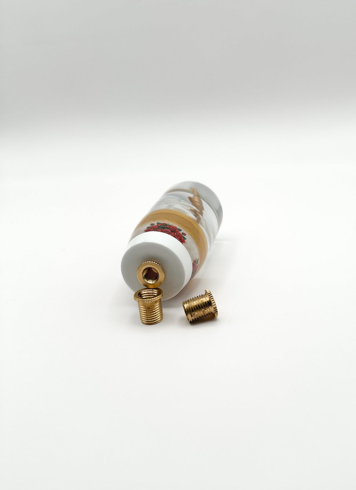 bottom of knob. Cupid Angel Ak47 Gun shift knob. gold with red roses flowers and white base. image shows bushings reducers that make universal and weighted. 