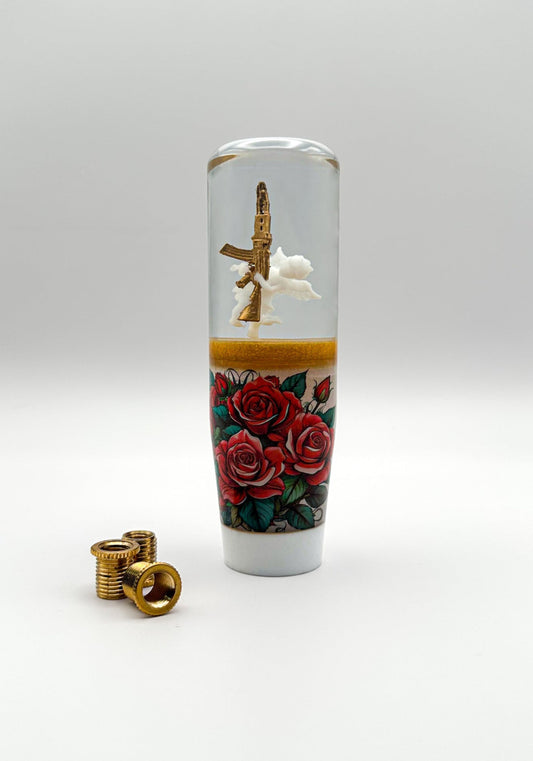 a white baby angel Cupid holding an ak 47 gun on a bed of roses shift knob shifter