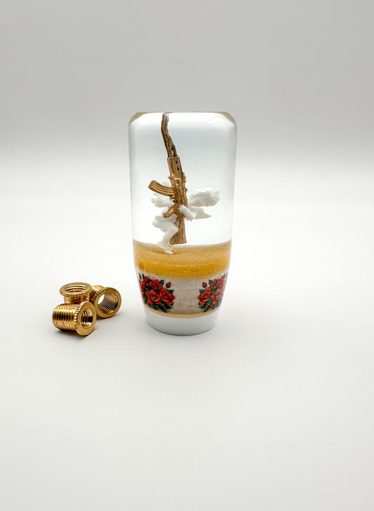 Cupid Angel Ak47 Gun shift knob. gold with red roses flowers and white base. image shows bushings reducers that make universal and weighted. 
