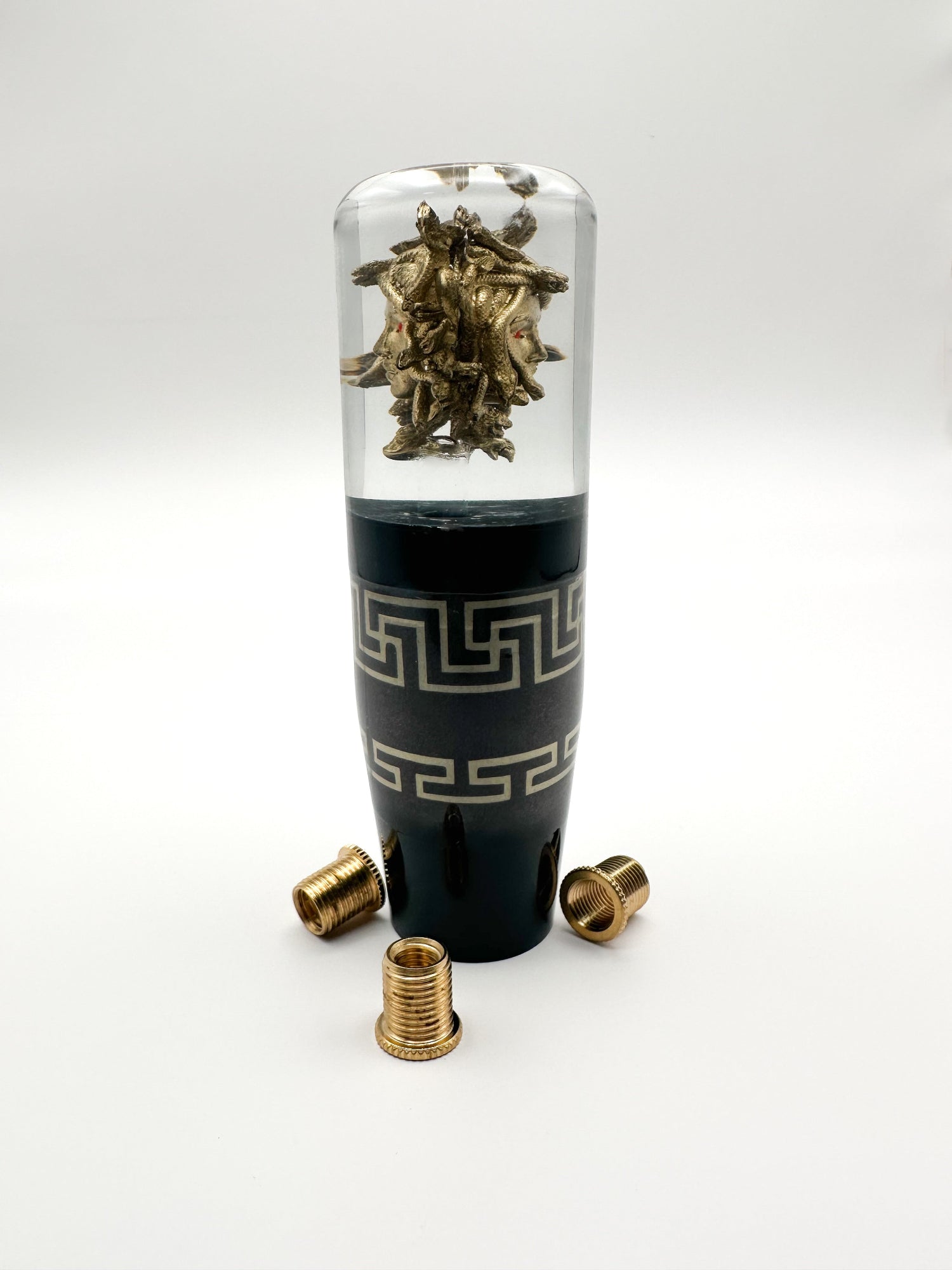 Oversized golden Medusa shift knob in clear resin with Versace-inspired design. 5.75" tall, weighted, and fits most manual and automatic cars.