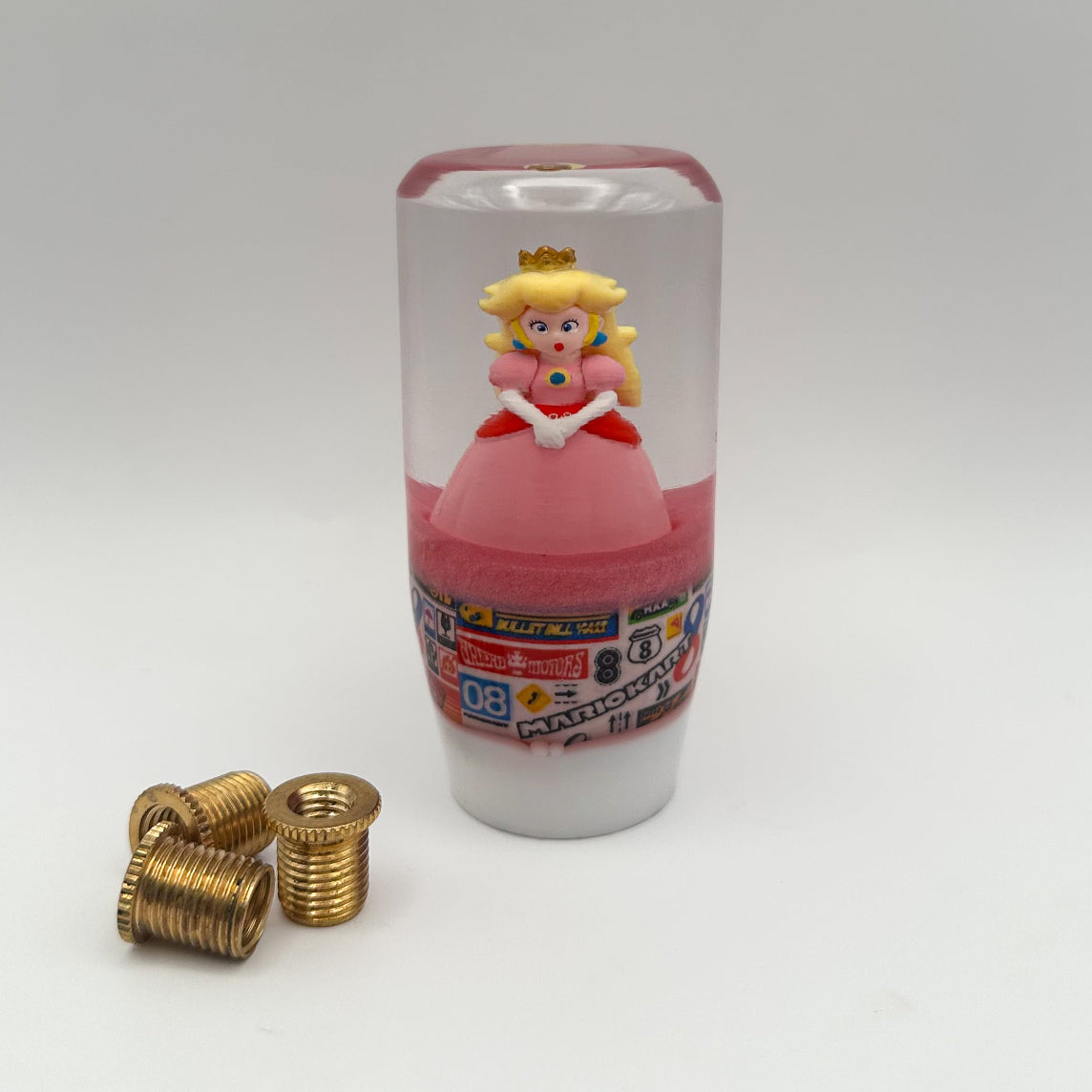 universal custom gear shifter featuring princess peach from Mario kart for manual cars