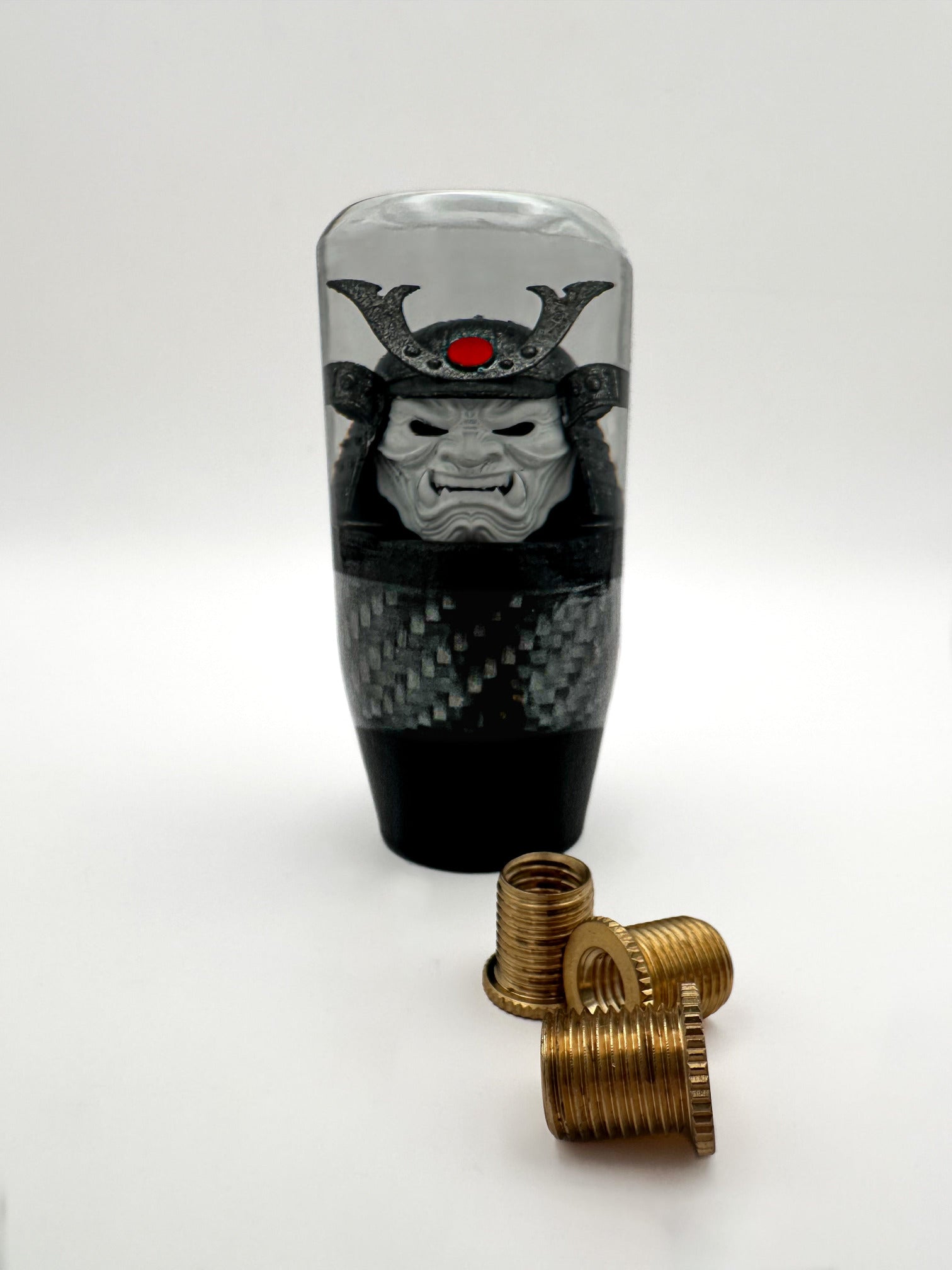 oni samurai shift knob, white face, gunmetal helmet, red accent. features real carbon fiber and black base. 