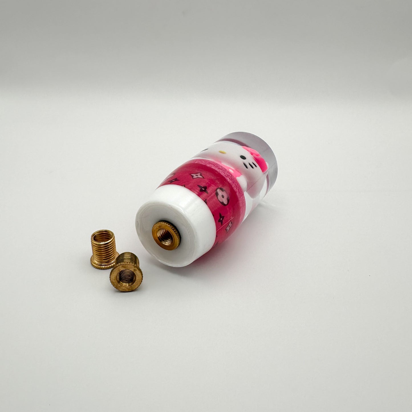 bottom of shift knob that features hello kitty kuromi and pink